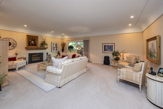 living room featuring light carpet and a brick fireplace