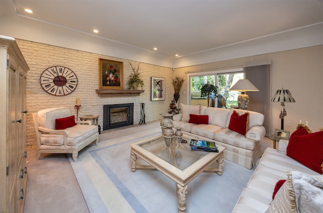 carpeted living room with a brick fireplace