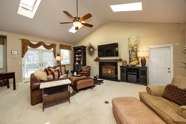 carpeted living room featuring ceiling fan and lofted ceiling