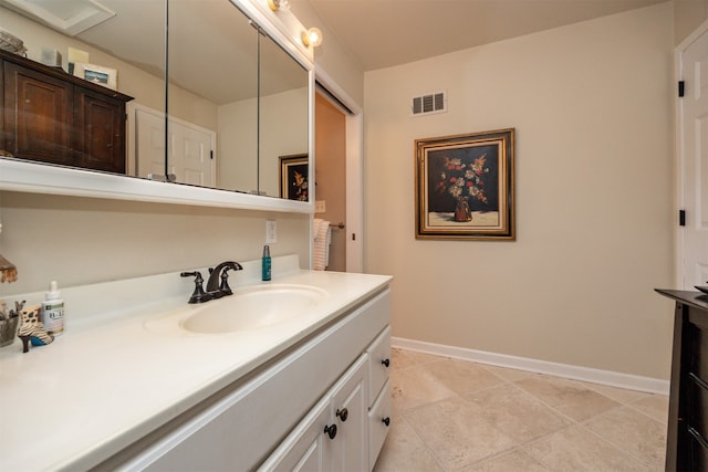 bathroom featuring vanity and tile patterned flooring