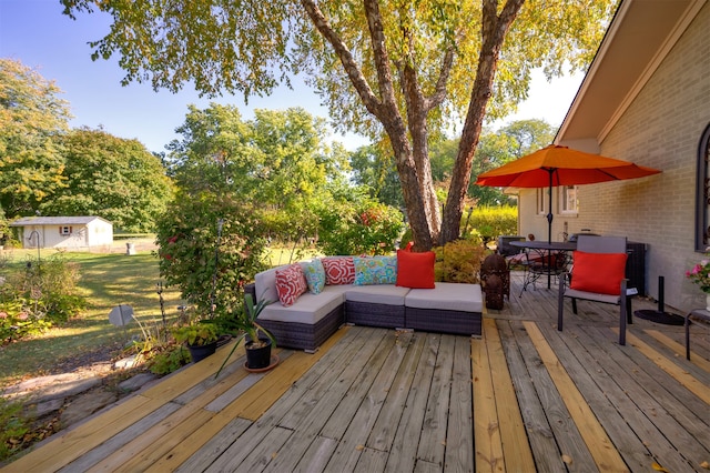 wooden deck featuring a shed and an outdoor hangout area