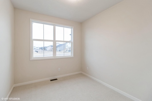 spare room with carpet floors