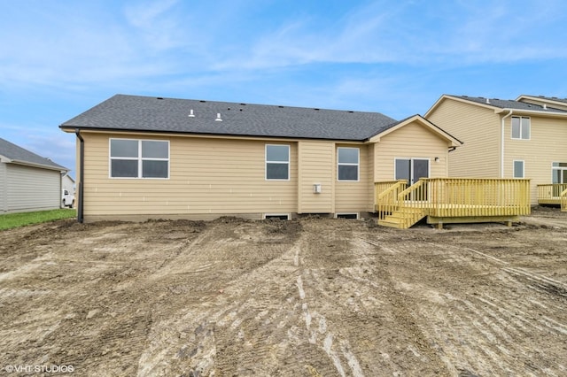 rear view of property with a deck