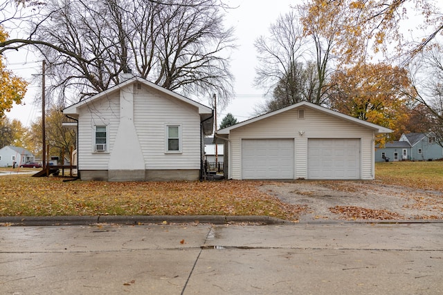 view of home's exterior with an outbuilding and a garage