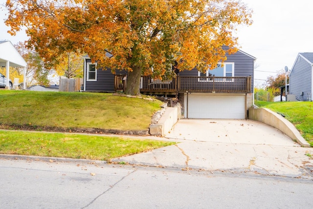 view of front of house with a garage and a front lawn