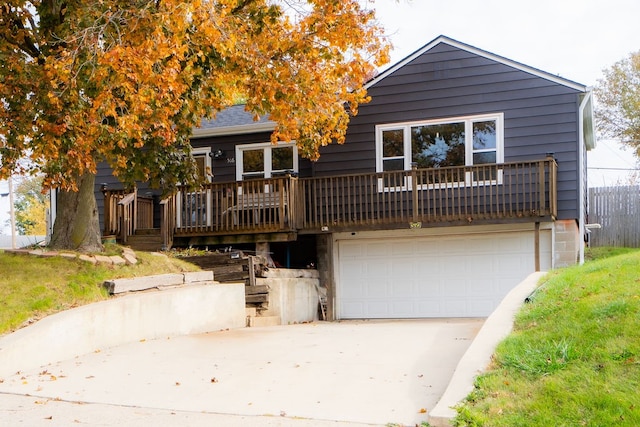 view of front of property featuring a garage and a deck