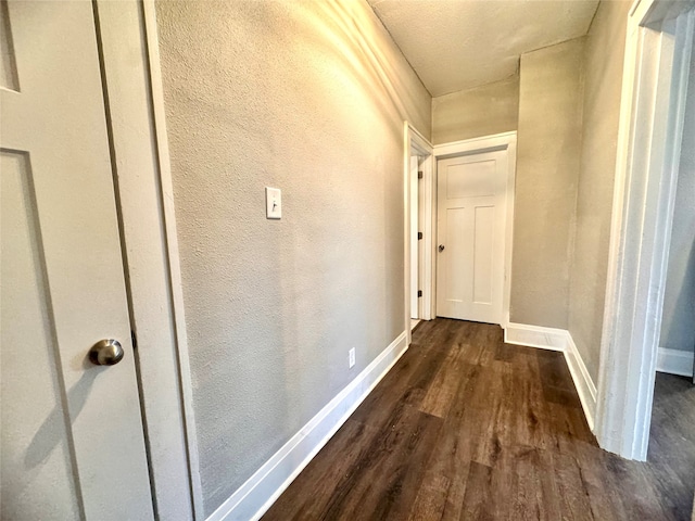 corridor featuring dark hardwood / wood-style floors