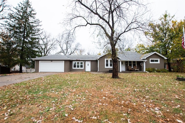 1600 Evergreen Ave, Des Moines, IA 50320 - ranch-style house featuring a garage, driveway, a porch, and a front lawn