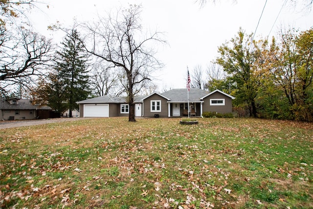 ranch-style home with a front yard and a garage