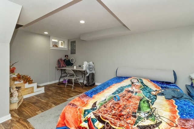 bedroom with dark wood-type flooring and electric panel