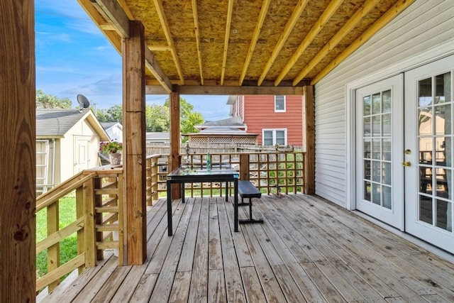 wooden deck featuring french doors