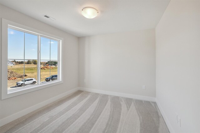 spare room with carpet flooring