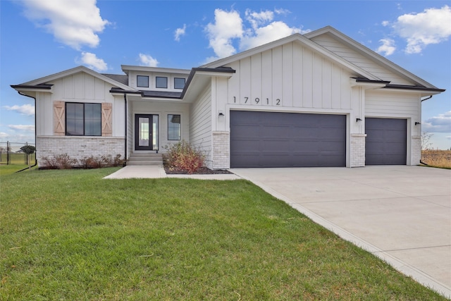 view of front of property with a front lawn and a garage