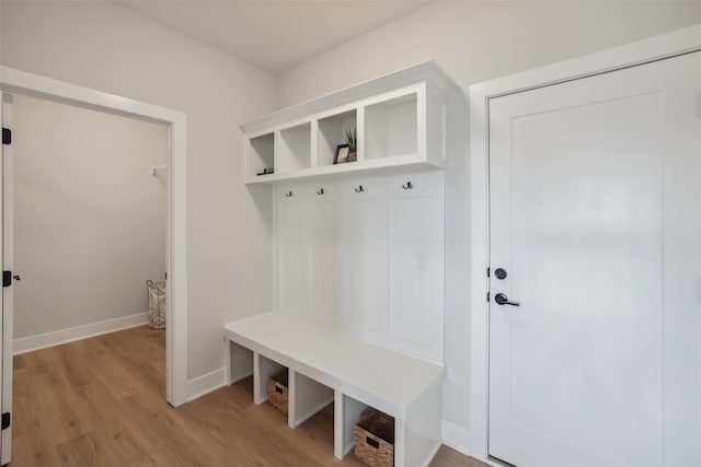 mudroom with light hardwood / wood-style floors