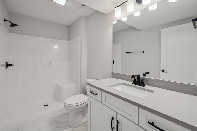 bathroom featuring a shower, vanity, and toilet