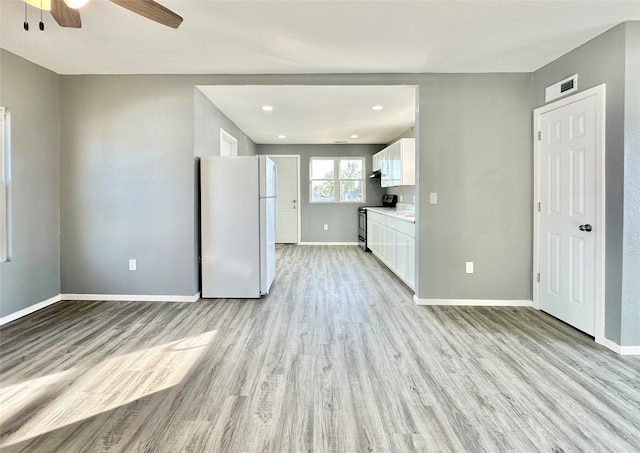 unfurnished living room with light wood-type flooring and ceiling fan