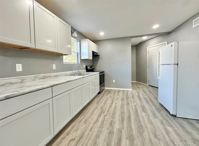 kitchen with electric range, light hardwood / wood-style flooring, white cabinets, and white refrigerator