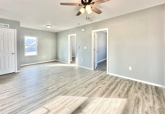 empty room featuring light hardwood / wood-style floors and ceiling fan