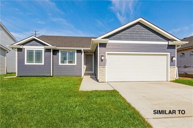 ranch-style house featuring a front yard and a garage