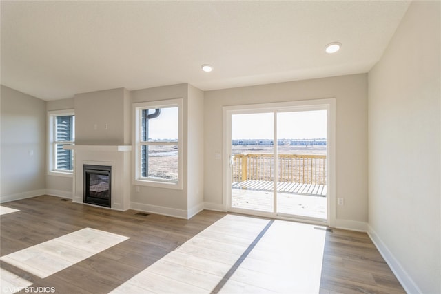 unfurnished living room with wood-type flooring