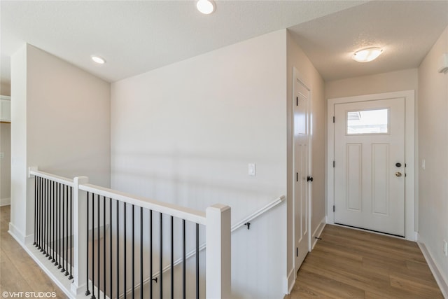 entrance foyer featuring hardwood / wood-style floors and a textured ceiling