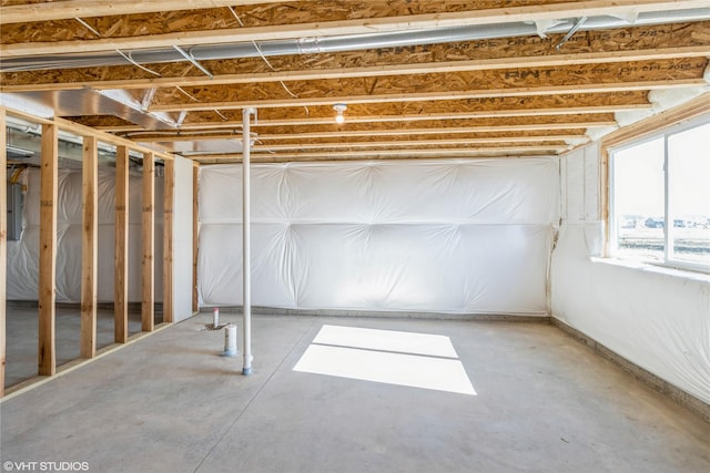 basement featuring electric panel