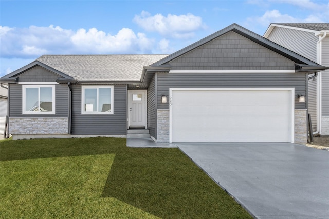 view of front facade with a garage and a front lawn