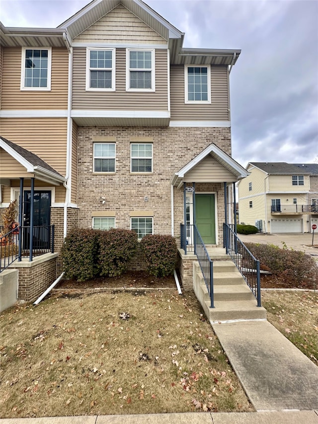 townhome / multi-family property featuring a garage