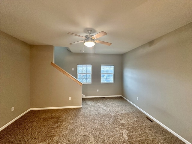 unfurnished room with carpet floors and ceiling fan