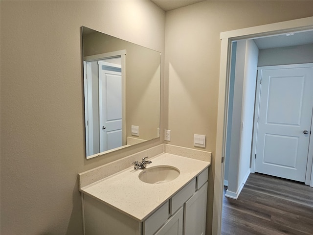 bathroom featuring vanity and hardwood / wood-style floors