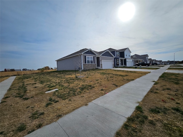 single story home featuring a front yard and a garage