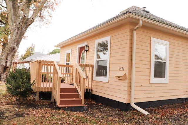 view of side of home featuring a deck