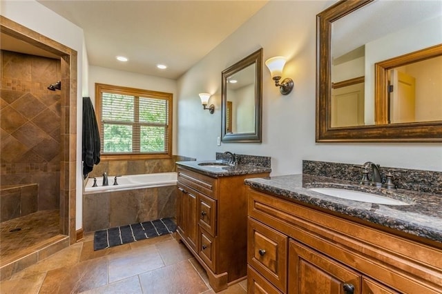 bathroom featuring vanity and shower with separate bathtub