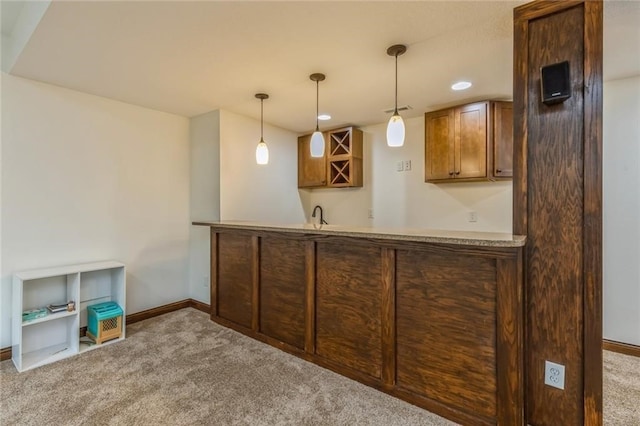 bar with decorative light fixtures and light colored carpet