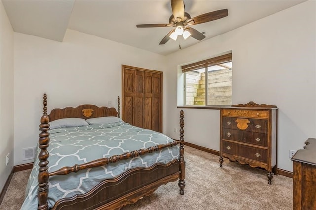 bedroom with a closet, carpet, and ceiling fan