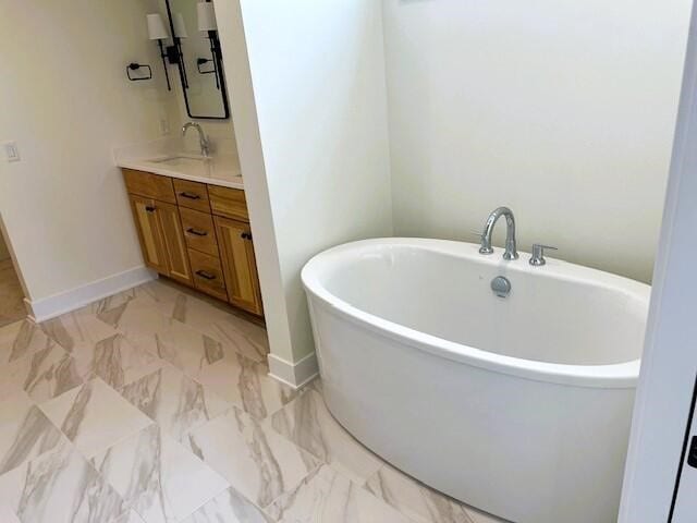 bathroom featuring a bath and vanity