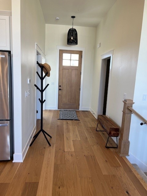 doorway with light hardwood / wood-style floors