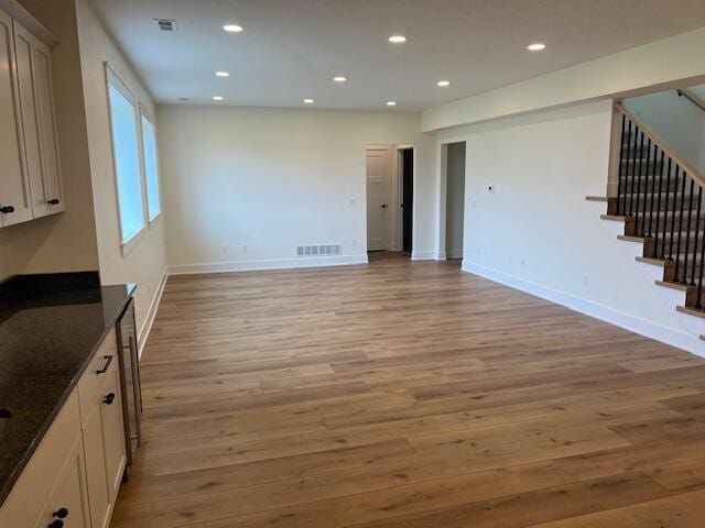 unfurnished living room with light hardwood / wood-style flooring