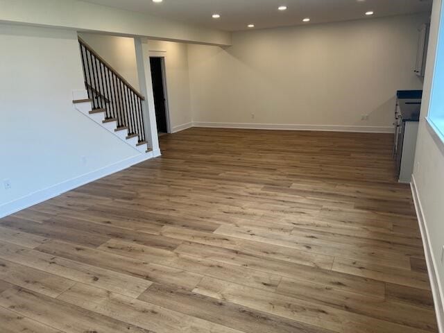 unfurnished living room featuring wood-type flooring