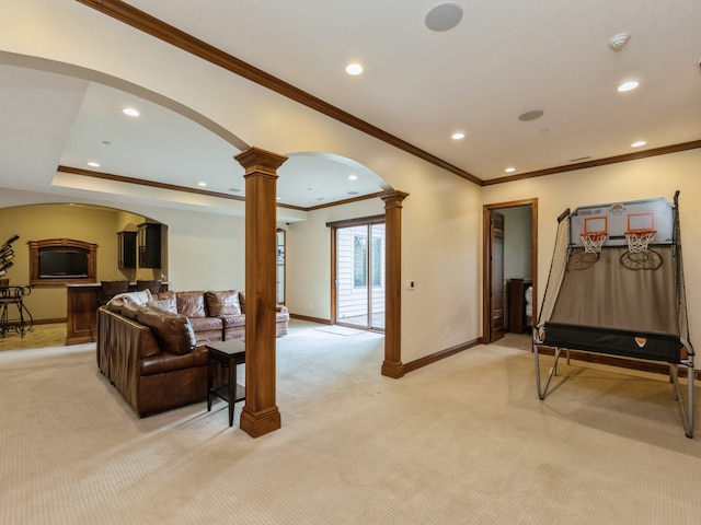 living room featuring baseboards, arched walkways, light colored carpet, ornate columns, and recessed lighting