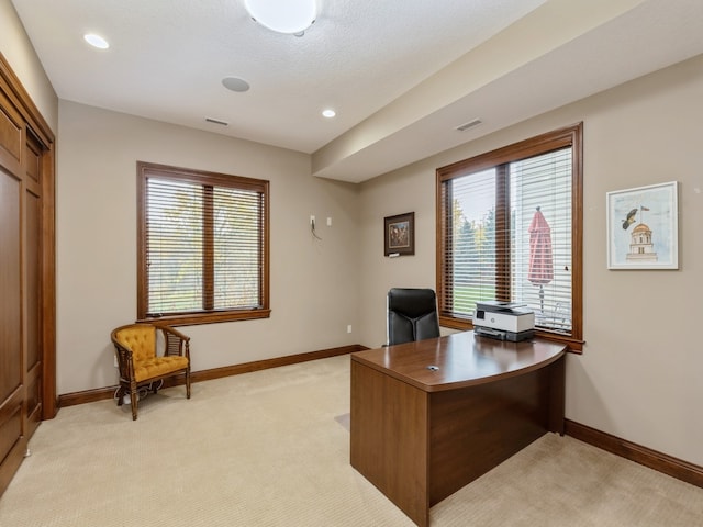 office space with recessed lighting, light carpet, visible vents, and baseboards