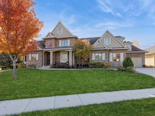 view of front facade with a garage and a front lawn