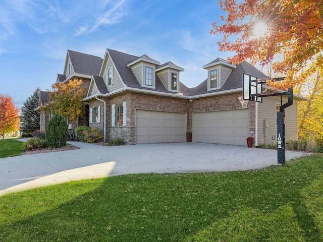 view of front of home featuring a garage, brick siding, a shingled roof, concrete driveway, and a front yard