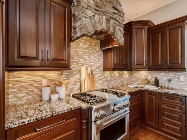 3123 162nd St, Urbandale, IA 50323 - kitchen with high end stainless steel range oven, backsplash, light stone countertops, dark wood finished floors, and wall chimney exhaust hood