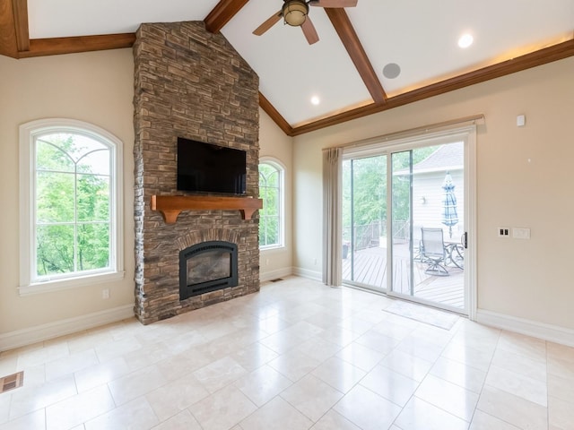 3123 162nd St, Urbandale, IA 50323 - unfurnished living room featuring a ceiling fan, baseboards, a stone fireplace, and tile patterned floors