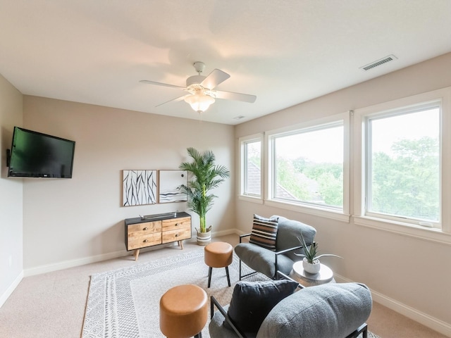 3123 162nd St, Urbandale, IA 50323 - living area featuring carpet floors, baseboards, and ceiling fan