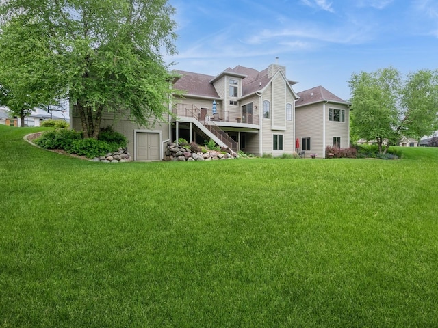 3123 162nd St, Urbandale, IA 50323 - back of property featuring stairway, a wooden deck, a yard, and a chimney