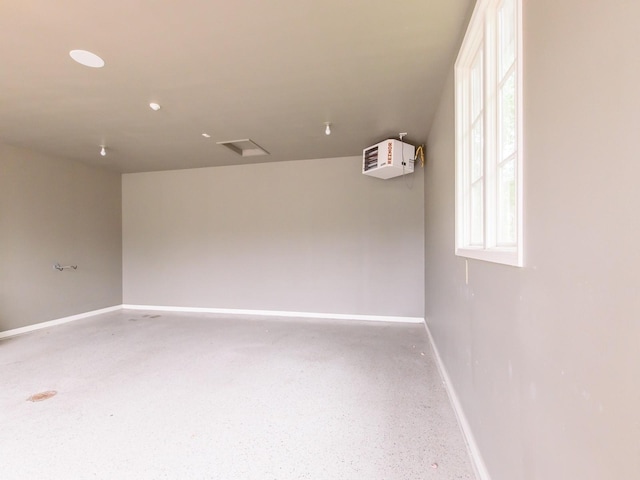 3123 162nd St, Urbandale, IA 50323 - empty room featuring baseboards and speckled floor