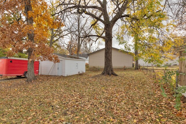 view of yard with an outbuilding and a garage