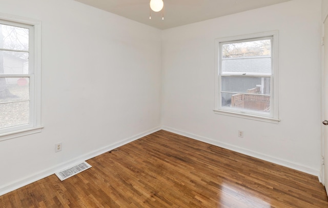 unfurnished room featuring hardwood / wood-style flooring and ceiling fan